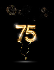 Gold balloon number 75 with fireworks in the background. Festive scene for birthday or anniversary party