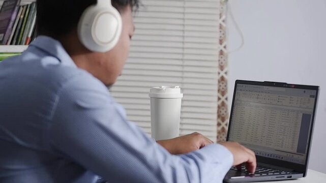 A man massages his sore shoulder while sitting in an office chair, dealing with back pain, stress, fatigue and discomfort due to work fatigue, arthritis and bad posture. Shoulder pain accompanied by o