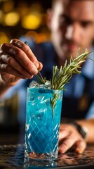 Refreshing blue cocktail garnished with sprigs of rosemary, beautifully crafted by a skilled bartender, capturing the essence of mixology and vibrant nightlife in a stylish bar setting.