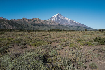 Fototapeta premium Snow-Capped Volcano Near Chilean Border in Patagonian Landscape