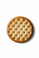 A single round cracker on a white background