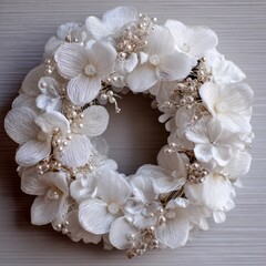 Delicate white floral wreath with pearls, perfect for weddings and celebrations