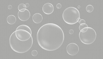 A set of various sized transparent soap or water bubbles with realistic reflections and highlights, isolated on a transparent checkered background.