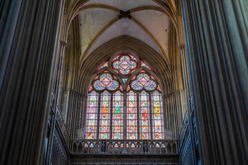 Stained glass window of the south transept seen from inside Notre-Dame Cathedral of Bayeux
