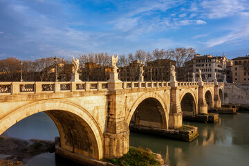 The iconic Ponte Sant'Angelo in Rome, Italy, The historic bridge and its famous angel statues crossing the Tiber River, a top European travel destination.
