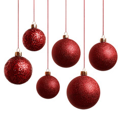 Obraz premium Close-up of festive, red, glitter-covered ornaments, each suspended by delicate strings. Festive elements for holiday decorations