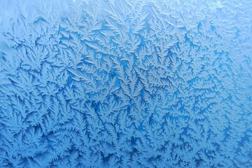 Intricate Frost Patterns and Ice Crystals on Frozen Glass Surface for Winter