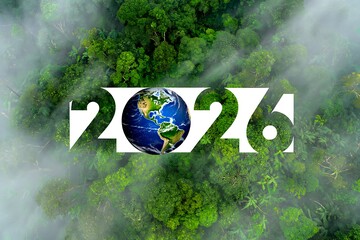 Aerial View of Dense Green Forest with 2026 Cutout Revealing Earth Globe