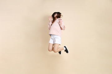 20s Asian woman in pink UV jacket