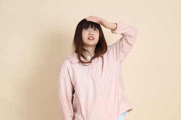 20s Asian woman in pink UV jacket