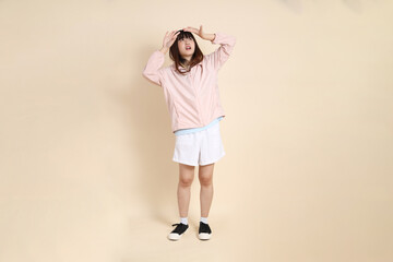 20s Asian woman in pink UV jacket