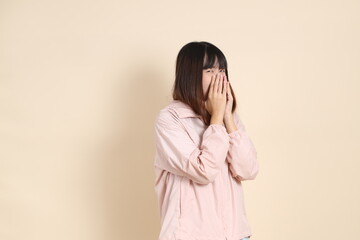 20s Asian woman in pink UV jacket