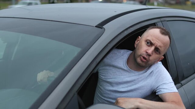 Road rage. Conflict. Man in a car. Slow motion video.High quality 4k footage