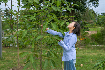 A collection of lifestyle images featuring a cheerful Asian man and woman spending time together in their backyard garden.
