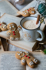 On the table there is New Year's tea 2026, coffee, gingerbread and pine cone cookies.