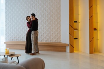 Couples dancing in a modern living space during a cozy evening together