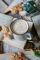 On the table there is New Year's tea 2026, coffee, gingerbread and pine cone cookies.