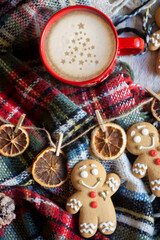 On the table there is New Year's tea 2026, coffee, gingerbread and pine cone cookies.