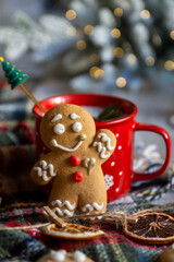 On the table there is New Year's tea 2026, coffee, gingerbread and pine cone cookies.