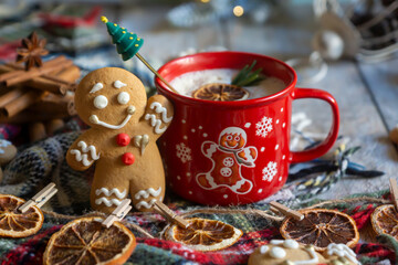 On the table there is New Year's tea 2026, coffee, gingerbread and pine cone cookies.