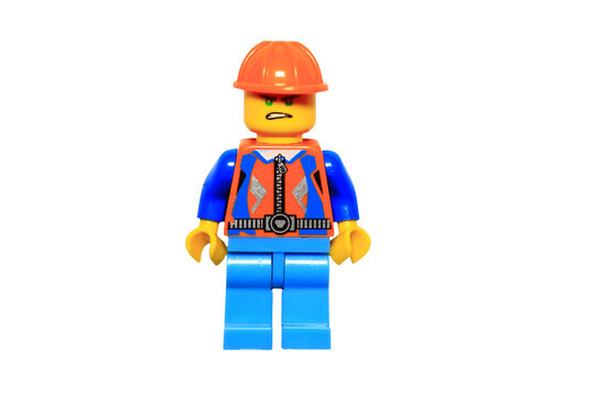 Lego minifigure in construction gear, isolated on a white background