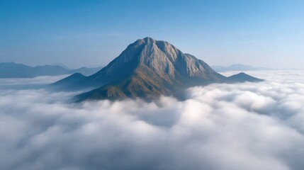 Majestic Mountain Summit Emerging from Sea of Clouds at Dawn, a Serene Landscape Offering Breathtaking Views and Natural Beauty