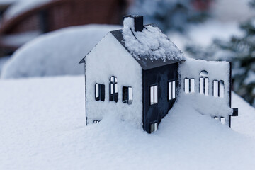 Small house lantern covered with snow in winter
