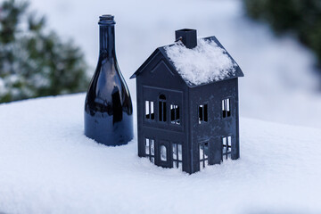Small house lantern covered with snow in winter