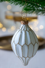 New Year 2026: champagne and Christmas tree decorations on the table.