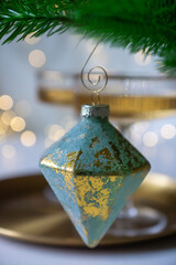 New Year 2026: champagne and Christmas tree decorations on the table.