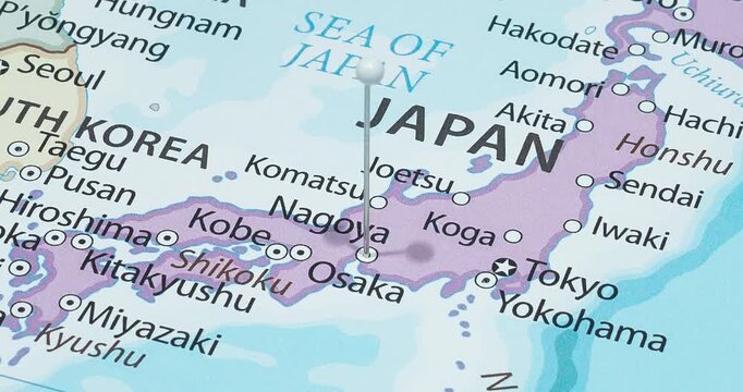 A zoom out of a white pin into nagoya city of japan political map