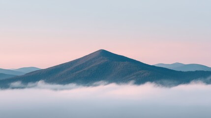 A Breathtaking Summit Emerges from Clouds at Dawn, Showcasing Inspiring Landscape with Soft Pastel Hues of Morning Light