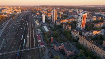 Aerial freight train leaving the station at sunset