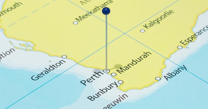 A zoom out of a blue pin into perth city of australia political map