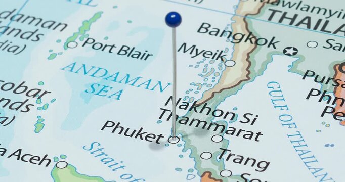 A zoom out of a blue pin into phuket city of Thailand political map