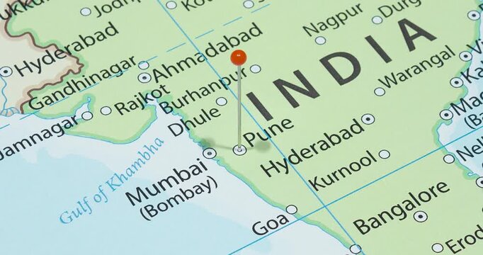 A zoom out of an orange pin into pune city of India political map