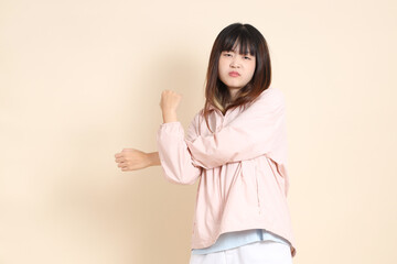 20s Asian woman in pink UV jacket