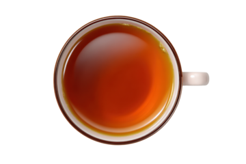 Warm drink in a cup on a plain surface during midday showing a rich color of tea