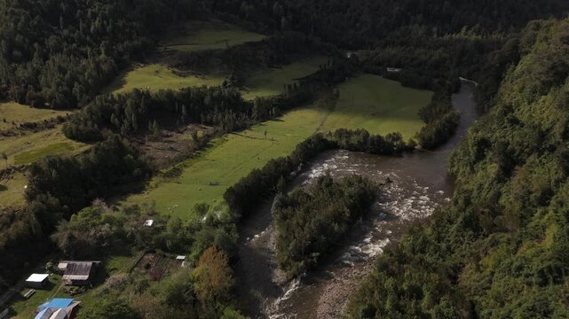 Aerial View of River Forming an Island in Valley Landscape