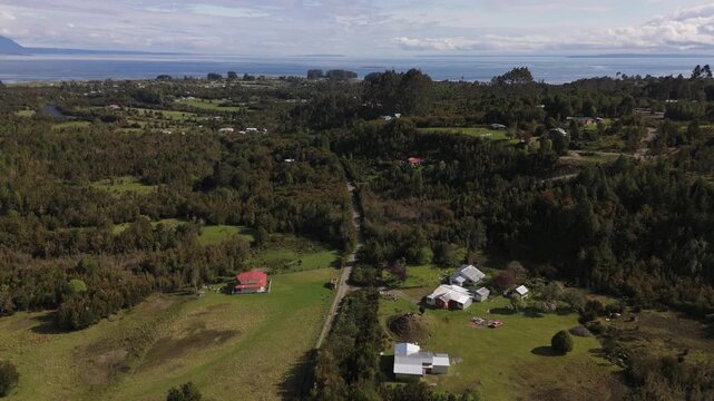 Aerial View of Rural Forest Hamlet and Coastal Bay