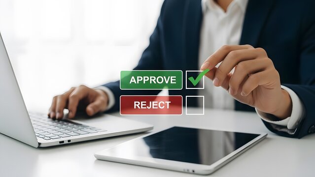 Hand clicking approve button on digital interface