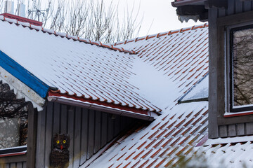 Snow covered tiled rooftops in winter