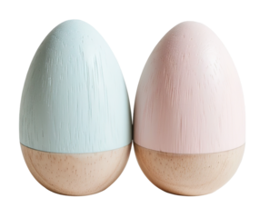 Two wooden eggs are painted in pastel blue and pink. They sit on a light wood base. This cut out element can be used in various designs or decorations. Simple and versatile for many uses