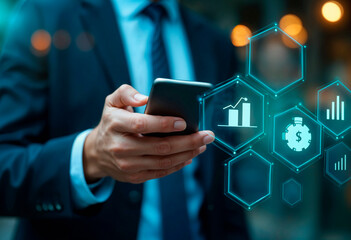 Businessman using laptop with rising monthly ecommerce sales chart and shopping cart icons, representing revenue growth, digital business analytics, and online retail strategy.