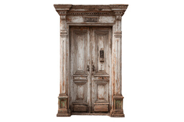 Fototapeta premium Old wooden door with detailed frame and weathered paint located in a rustic setting on a bright day