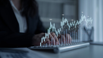 A professional woman types on a laptop, surrounded by modern office features, as a digital financial graph overlays the scene, representing growth and data analysis. Scalp
