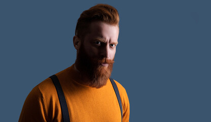 Obraz premium Mature redhead man with hairstyle. Vintage male fashion style. Male vintage style. Vintage brutality guy wear retro suspenders. Retro man in suspenders isolated on grey, advertisement