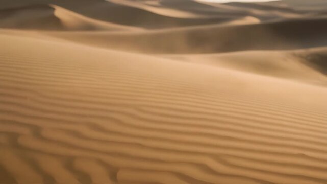Blurred view of sand dunes in a desert landscape, showcasing the natural patterns and textures of the sand
