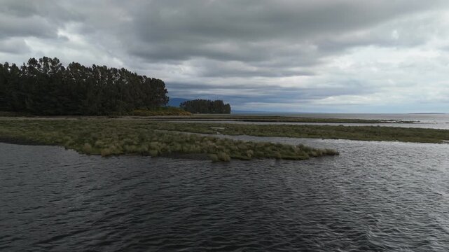 Aerial Side View of Bay Shoreline with Floating Islands and Swamps