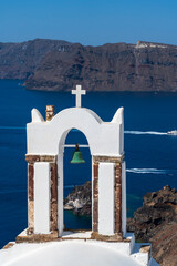 Single church bell with a view of the Agean Sea in Oia, Santorini, Greece